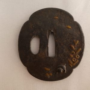 Japanese Tsuba (Sword Guard) for wakizashi in gold inlay featuring a foo dog.
