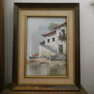 Spanish oil painting of house in the Mediterranean with small boats.