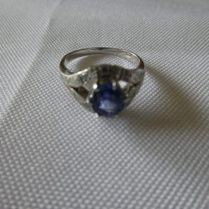 Ladies platinum ring with sapphire and diamonds